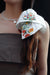 white embroidered hair tie